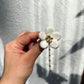 Broche floral de cerámica